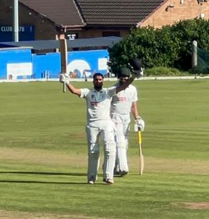 Ismael Patel celebrating reaching 100 runs for the first time in first team cricket.