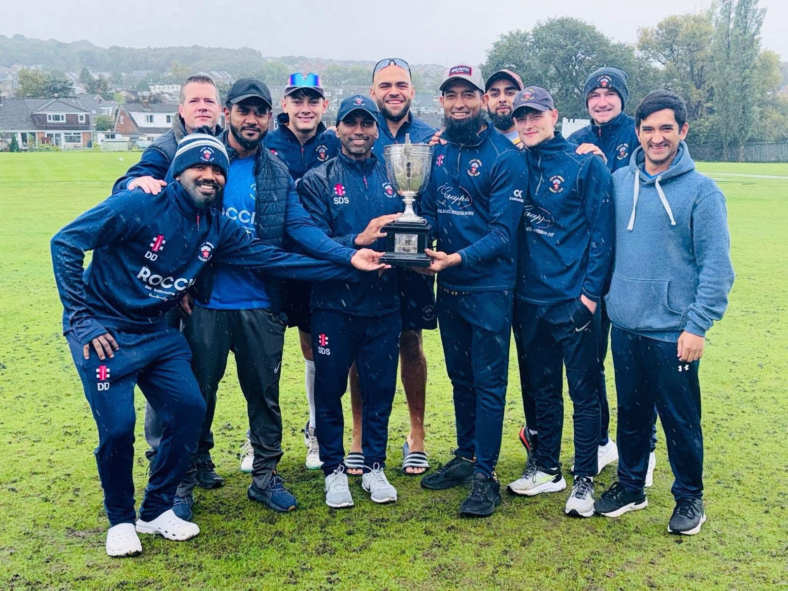 2025 Team photo holding the NWCL Championship trophy